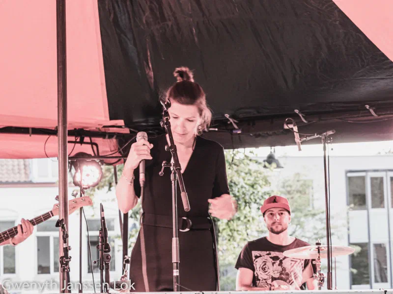 A singer at the microphone with Fabio D’Amico on drums behind her at the Delft Jazz Festival