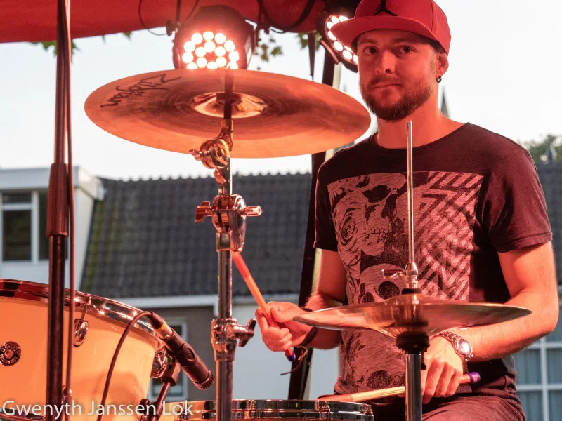 Fabio D’Amico playing drums under stage lights at the Delft Jazz Festival